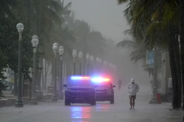 Police patrol the Hollywood Beach Broadwalk as conditions deteriorate with the approach of Hurricane Nicole, Wednesday, November 9, 2022, in Hollywood Beach in Hollywood, Fla. (Photo by Wilfredo Lee/AP Photo)