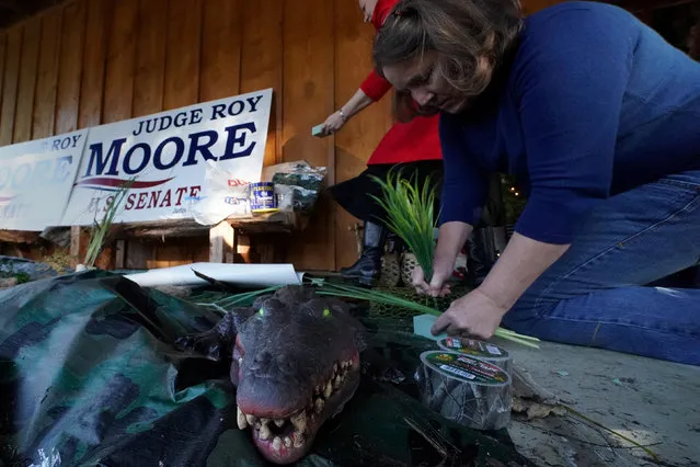 Workers set up an artificial “swamp” outside a venue where Republican Senate candidate Roy Moore will hold a rally in Midland City, Alabama, U.S., December 11, 2017. (Photo by Carlo Allegri/Reuters)