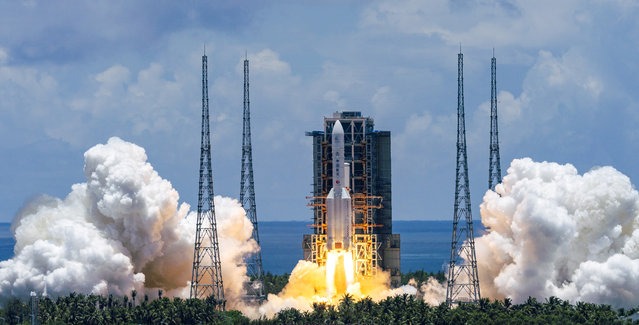In this photo released by China's Xinhua News Agency, a Long March-5 rocket carrying the Tianwen-1 Mars probe lifts off from the Wenchang Space Launch Center in southern China's Hainan Province, Thursday, July 23, 2020. China launched its most ambitious Mars mission yet on Thursday in a bold attempt to join the United States in successfully landing a spacecraft on the red planet. (Photo by Cai Yang/Xinhua via AP Photo)