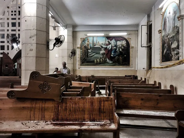 Blood stains remain on pews inside the St. George Church after a suicide bombing in the Nile Delta town of Tanta, Egypt, on April 9, 2017. Bombs exploded at two Coptic churches in the northern Egyptian cities of Tanta and Alexandria as worshippers were celebrating Palm Sunday, killing over 40 people and wounding scores more. (Photo by Nariman El-Mofty/AP Photo)