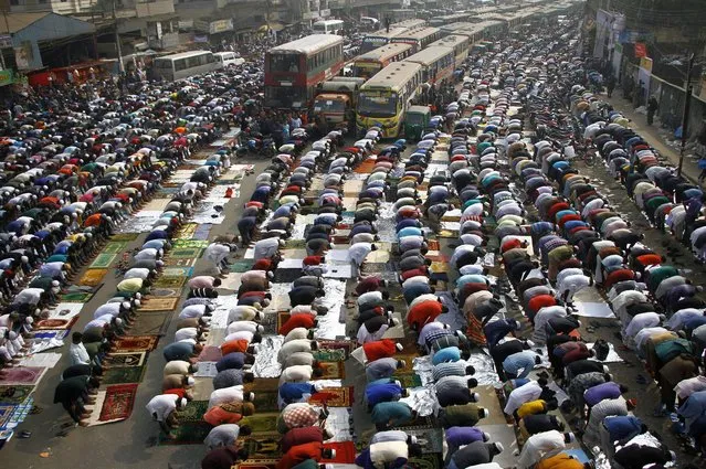 Bangladeshi residents offer Friday prayers as the world largest Muslims congregation begins in Tongi on January 12, 2018. Bishwa Ijtema, the biggest congregations of Muslims after the Hajj, has begun in Bangladesh. (Photo by Rehman Asad/AFP Photo)