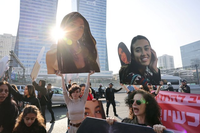 Demonstrators block the main highway as they hold signs with the faces of female hostages held in Gaza since October 7 and to call for their immediate release, amid the ongoing conflict between Israel and Palestinian Islamist group Hamas, in Tel Aviv, Israel on March 14, 2024. (Photo by Tomer Appelbaum/Reuters)