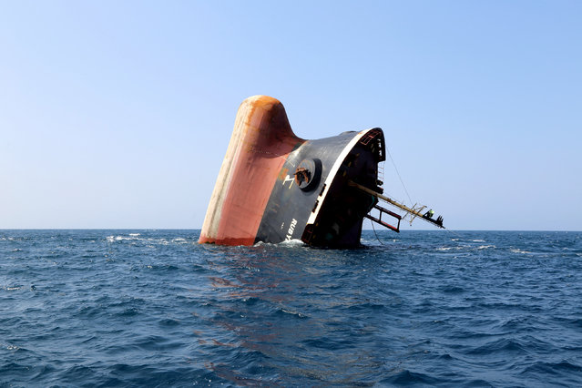 This picture taken on March 7, 2024 shows the Rubymar cargo ship partly submerged off the coast of Yemen. The bulk carrier went down off Yemen after a Huthi missile attack and poses grave environmental risks as thousands of tonnes of fertiliser threaten to spill into the Red Sea, officials and experts warn. The Belize-flagged, Lebanese-operated Rubymar sank on Saturday with 21,000 metric tonnes of ammonium phosphate sulfate fertiliser on board, according to US Central Command. (Photo by Khaled Ziad/AFP Photo)