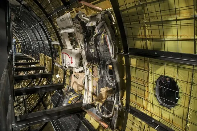 A damaged exit door of the MH17 airplane is seen after the presentation of the final report into the crash of July 2014 of Malaysia Airlines flight MH17 over Ukraine, in Gilze Rijen, the Netherlands, October 13, 2015. (Photo by Michael Kooren/Reuters)