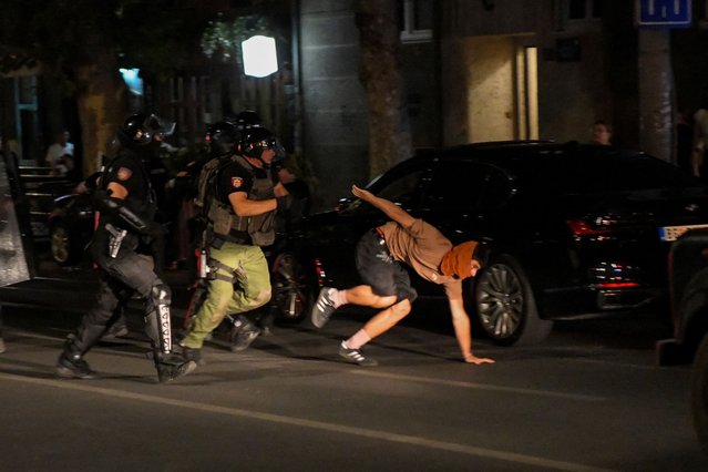 Law enforcement officers try to detain a man during road blockades organised by students and anti-government demonstrators demanding snap elections and release of arrested protestors, in Belgrade, Serbia, on July 3, 2025. (Photo by Amir Hamzagic/Reuters)