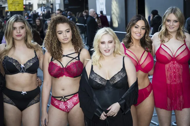 Actress Hayley Hasselhoff, centre, along with models, diversity campaigners and social media influencers protest the lack of female curves in the fashion industry outside a fashion week venue in London, Friday, February 16, 2017. (Photo by Vianney Le Caer/Invision/AP Photo)