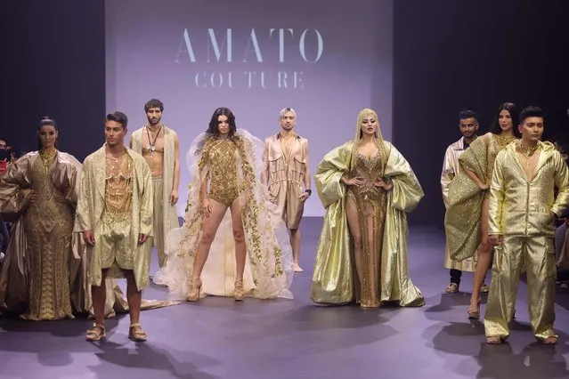 Models present creations by Amato Couture during the Arab Fashion Week in Dubai, on January 28, 2022. (Photo by Giuseppe Cacace/AFP Photo)