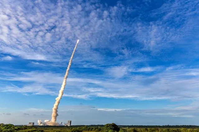 The Ariane 5 rocket lifts off from the Ariane Launchpad Area at the European Spaceport in Kourou, French Guiana, on October 5, 2016. The rocket successfully launched a pair of communications satellites, the australian SKY Muster II and the indian GSAT-18. (Photo by  Jody Amiet/AFP Photo)