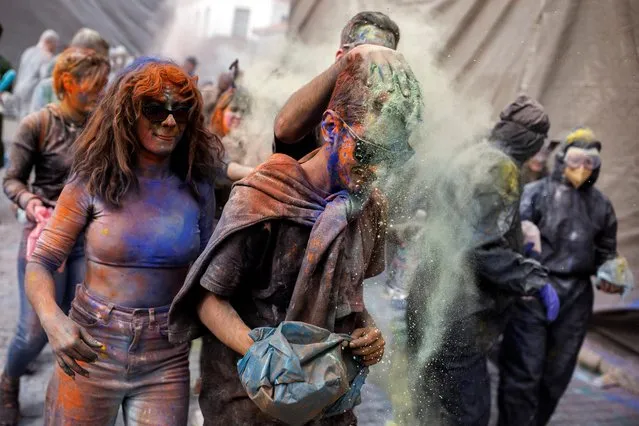 Revellers celebrate “Ash Monday” by participating in a colourful “flour war”, a traditional festivity marking the end of the carnival season and the start of the 40-day Lent period until the Orthodox Easter, in the port town of Galaxidi, Greece on February 27, 2023. (Photo by Alkis Konstantinidis/Reuters)