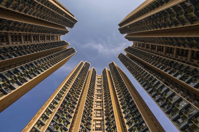 This picture taken on May 8, 2024 shows apartment blocks at Choi Ming Court housing estate in Hong Kong. Home to some of the world's densest living districts and tallest skyscrapers, Hong Kong has more than 550 buildings that are at least 150 metres (490 feet) tall and is the “number one tallest city” in the world, according to the Council on Tall Buildings and Urban Habitat skyscraper database. (Photo by Dale de la Rey/AFP Photo)