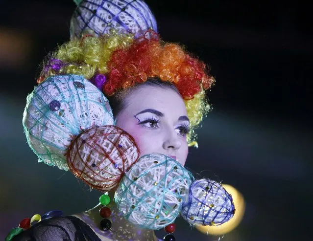 A model presents a hairstyle during the 7th international festival of hairdressing art, fashion and design called “Crystal Angel” in Kiev, April 18, 2013. (Photo by Gleb Garanich/Reuters)