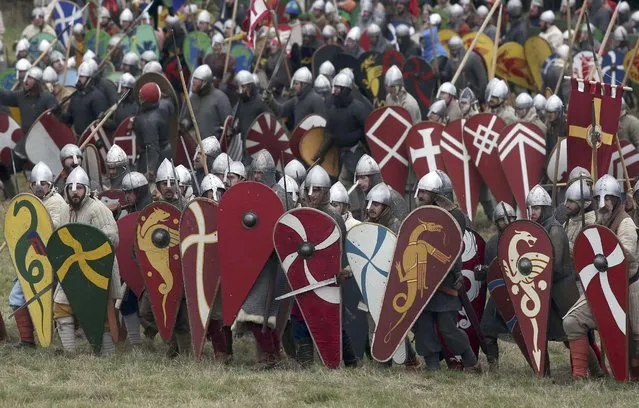 Re-enactors participate in a re-enactment of the Battle of Hastings, commemorating the 950th anniversary of the battle, in Battle, Britain October 15, 2016. (Photo by Neil Hall/Reuters)