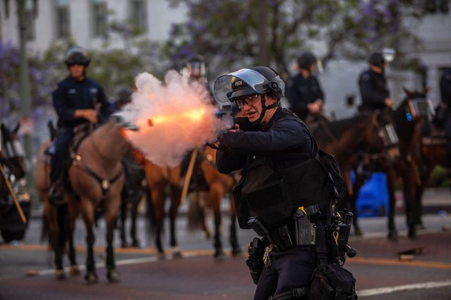 Los Angeles Police Department (LAPD) officers shoot rubber bullets at protesters in front of the City Hall on June 08, 2025 in Los Angeles, California. Tensions in the city remain high after the Trump administration called in the National Guard against the wishes of city leaders following two days of clashes with police during a series of immigration raids. (Photo by Apu Gomes/Getty Images)