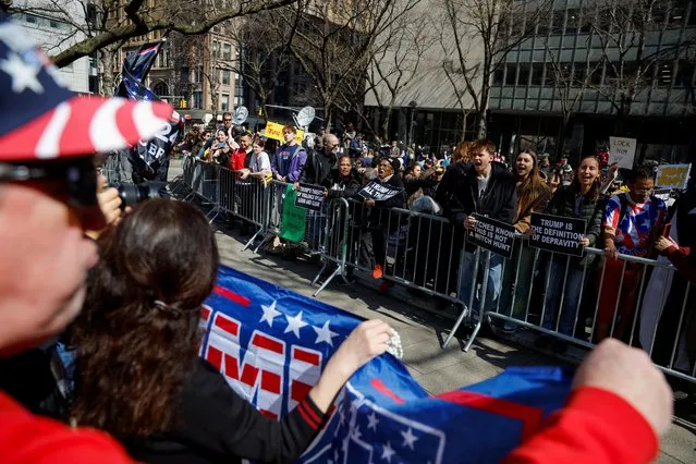Anti-Trump protesters demonstrate facing Trump supporters outside Manhattan Criminal Courthouse on the day of former U.S. President Donald Trump's planned court appearance after his indictment by a Manhattan grand jury following a probe into hush money paid to p*rn star Stormy Daniels, in New York City, U.S., April 4, 2023. (Photo by Amanda Perobelli/Reuters)
