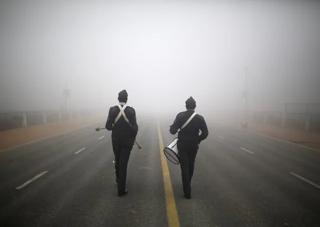 Indian Air Force band personnel perform as they rehearse for the Republic Day parade on a cold and foggy winter morning in New Delhi December 30, 2014. (Photo by Ahmad Masood/Reuters)
