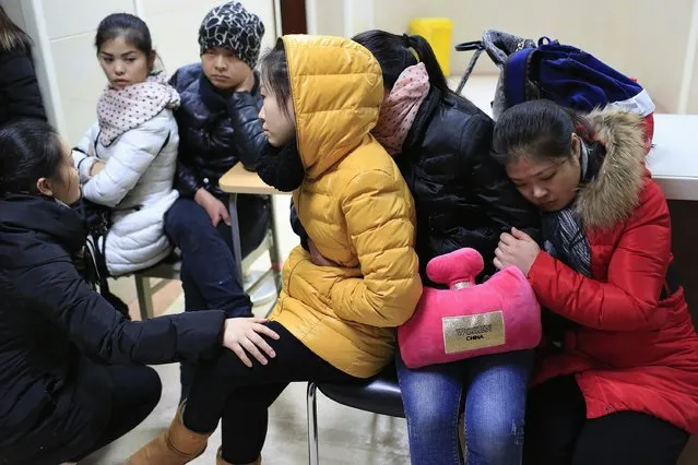 Relatives wait at a hospital where people injured in a stampede are being treated in Shanghai January 1, 2015. (Photo by Aly Song/Reuters)