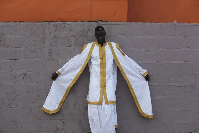 Model Awuah poses for a picture in a bazin outfit made by designer Mariah Bocoum Keita in Bamako, Mali, October 21, 2015. (Photo by Joe Penney/Reuters)