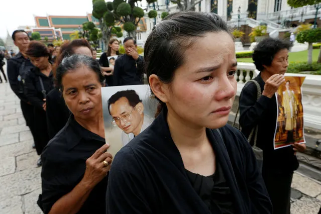 Mourners line up to get into the Throne Hall at the Grand Palace for the first time to pay their respects in front of the golden urn of Thailand's late King Bhumibol Adulyadej in Bangkok, Thailand, October 29, 2016. (Photo by Jorge Silva/Reuters)