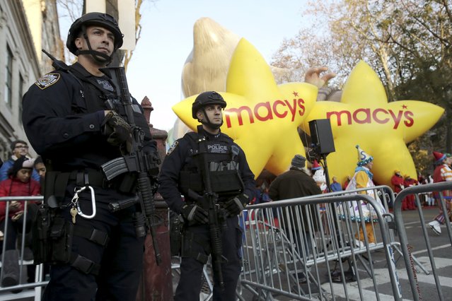 Members of the New York Police Department's Emergency Service Unit stand guard before the 89th Macy's Thanksgiving Day Parade in the Manhattan borough of New York, November 26, 2015. (Photo by Andrew Kelly/Reuters)