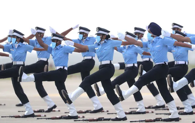 Indian Air Force (IAF) cadets march during a graduation parade at the Air Force Academy in Dundigal, on the outskirts of Hyderabad, India, Saturday, June 20, 2020. A total of 123 flight cadets including 19 women officers were commissioned as flying officers on Saturday on successful completion of their training, a press release said. (Photo by Mahesh Kumar A./AP Photo)