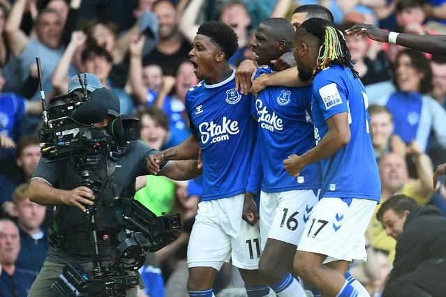 Everton's French midfielder Abdoulaye Doucoure (2ndL) celebrates with teammates after scoring the opening goal during the English Premier League football match between Everton and Bournemouth at Goodison Park in Liverpool, northwest England, on May 28, 2023. (Photo by Peter Powell/AFP Photo)