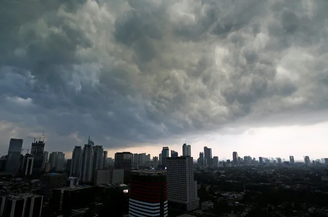 Storm clouds gather over Central Jakarta, Indonesia July 5, 2016. (Photo by Darren Whiteside/Reuters)