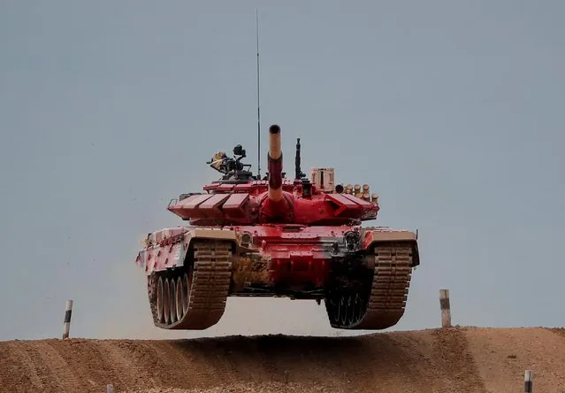 A T-72 B3 tank operated by a crew from Russia jumps during the Tank Biathlon competition at the International Army Games 2020 in Alabino, outside Moscow, Russia on September 2, 2020. (Photo by Maxim Shemetov/Reuters)