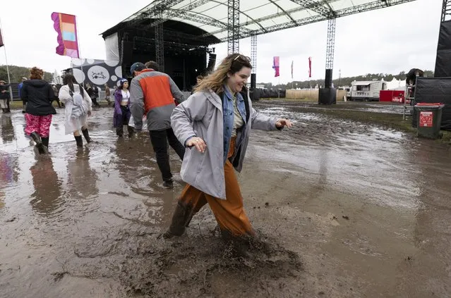 A festival goer is seen in mud during Splendour in the Grass 2022 at North Byron Parklands on July 22, 2022 in Byron Bay, Australia. Festival organisers have cancelled the first day of performances at Splendour in the Grass due to heavy rain at the festival site. (Photo by Matt Jelonek/Getty Images)