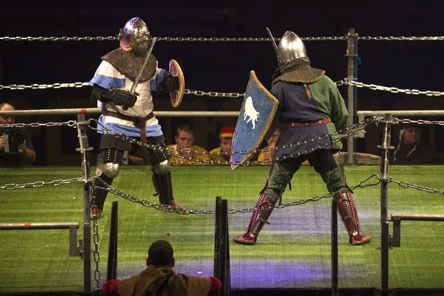 An Israeli competitor (L) fights a Belarus competitor during the “World Medieval Fighting Championship – the Israeli Challenge” in Rishon Letzion near Tel Aviv on January 22, 2015. (Photo by Amir Cohen/Reuters)