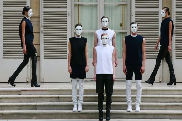 Models present creations by Jordan-born designer Rad Hourani as part of his Haute Couture Fall Winter 2013/2014 fashion show in Paris, on July 5, 2013. (Photo by Gonzalo Fuentes/Reuters)