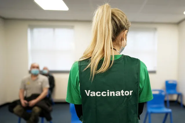 A vaccinator at the Arnison Vaccination Centre near Durham waits to assist patients on February 22, 2021 in Durham, England. The Arnison Centre site is the third Large Vaccination Centre for the North East region to open and joins the two Large Vaccination Centres which are at Newcastle’s Centre for Life and the NHS Nightingale Hospital North East, Sunderland and will increase the capacity to help the NHS vaccinate as many people as possible as quickly as possible. The Durham site will be known as the Arnison Vaccination Centre and is based at the Arnison shopping and retail park. The location was chosen in consultation with local partners for its accessible location and good public transport links. The Centre will be run by clinical staff, people who have been trained to become vaccinators, administrative staff and a range of volunteers. (Photo by Ian Forsyth/Getty Images)