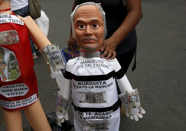 An effigy of former President of the Peruvian Football Federation Manuel Burga is seen in a market in Lima, Peru, December 30, 2015. (Photo by Mariana Bazo/Reuters)