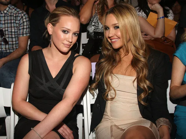 Hilary Duff and Amanda Bynes attend the Herve Leger Spring 2010 Fashion Show at the Promenade at Bryant Park on September 13, 2009 in in New York City. (Photo by Jason Kempin/Getty Images for Herve Leger)
