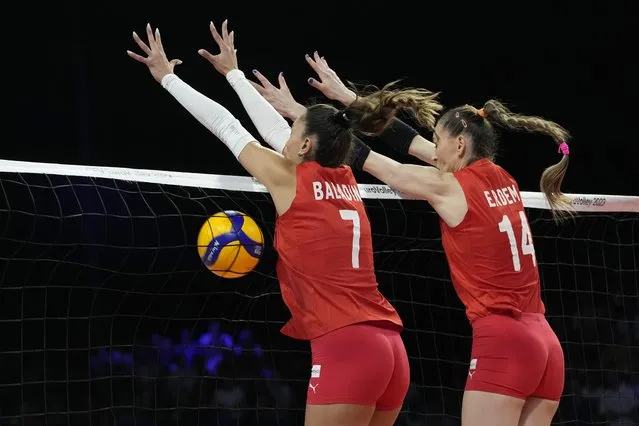 Turkey's Hande Baladin, left, Turkey's Eda Erdem Dundar go up for a block during the Women's European Volleyball Championship final match between Serbia and Turkey in Brussels, Belgium, Sunday, Sepember. 3, 2023. (Photo by Virginia Mayo/AP Photo)