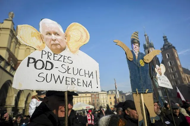 People demonstrate during an anti-government rally in Krakow, Poland January 23, 2016. Thousands of Poles marched through Warsaw on Saturday to protest against their new conservative government's plan to increase its surveillance powers, which critics say will undermine privacy rights. The poster shows Law and Justice leader Jaroslaw Kaczynski and reads “Chairman overhears sovereign”. (Photo by Lukasz Krajewski/Reuters/Agencja Gazeta)