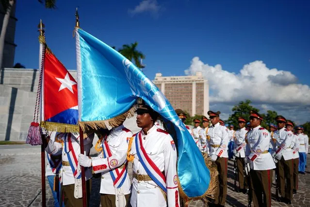 Members of an honour guard hold a Cuban and a UN flag as they stand next to the Jose Marti monument (not pictured) after a ceremony ahead of the G77+China summit in Havana, Cuba on September 14, 2023. (Photo by Alexandre Meneghini/Reuters)