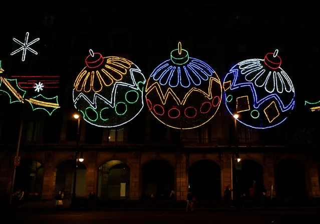 Buildings around Zocalo Square are decorated with lights as part of Christmas celebrations in Mexico City, Mexico December 22, 2016. (Photo by Henry Romero/Reuters)