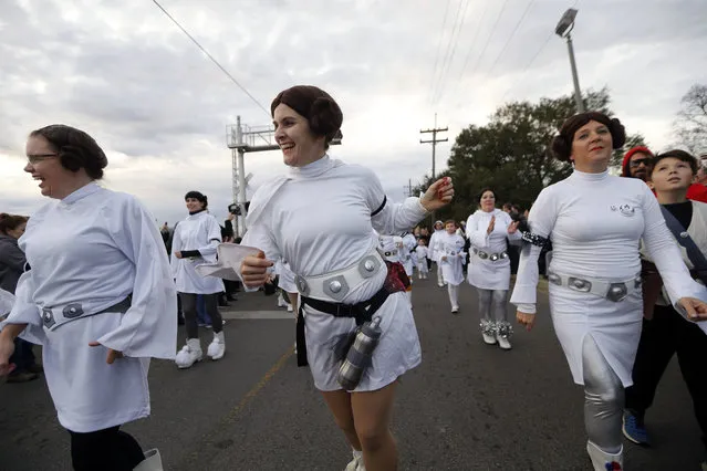 Members of the Krewe of Chewbacchus, a Mardi Gras Krewe, hold a parade with members dressed as Princess Leia, in honor of actress Carrie Fisher, who played Leia in the “Star Wars” movie series, in New Orleans, Friday, December 30, 2016. (Photo by Gerald Herbert/AP Photo)