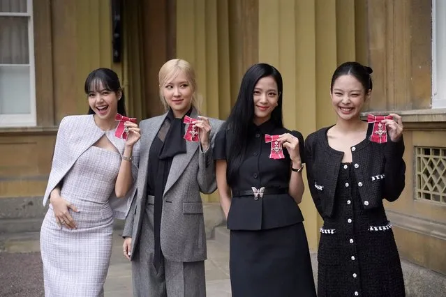 Lisa (Lalisa Manoban), Rose (Roseanne Park), Jisoo Kim and Jennie Kim, from the K-Pop band Blackpink pose with their Honorary MBEs (Members of the Order of the British Empire), awarded to them in recognition of the band's role as COP26 advocates for the COP26 Summit in Glasgow 2021, on the day of a special Investiture ceremony conducted by Britain's King Charles in the presence of the President of South Korea, Yoon Suk Yeol, and his wife, Kim Keon Hee, at Buckingham Palace, London, Britain on November 22, 2023. (Photo by Victoria Jones/Pool via Reuters)