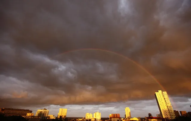 A rainbow is seen at dawn as clouds form a tropical storm over Havana, November 2009. (Photo by Desmond Boylan/Reuters)