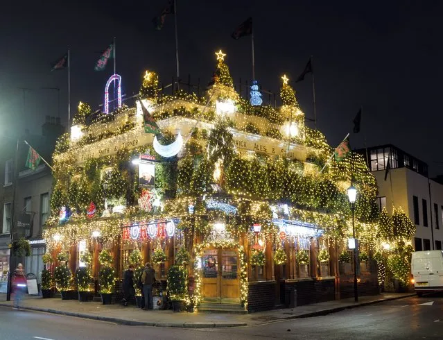 The Churchill Arms Pub, in Kensington with thousands of Christmas lights on during the festive period is now one of the most instagrammed venues in London. Pictured: General view in the last decade of November 2023. (Photo by Splash News and Pictures)