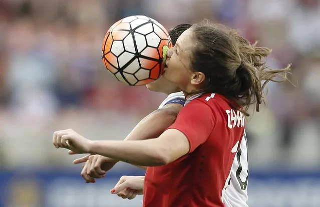 Canada’s Allysha Chapman is hit in the face as she goes up for a header alongside the US’s Carli Lloyd, during the Concacaf Olympic women’s soccer qualifying championship final at BBVA Compass stadium in Houston, US on February 21, 2016. The US won 2-0. (Photo by Thomas Shea/USA Today Sports)