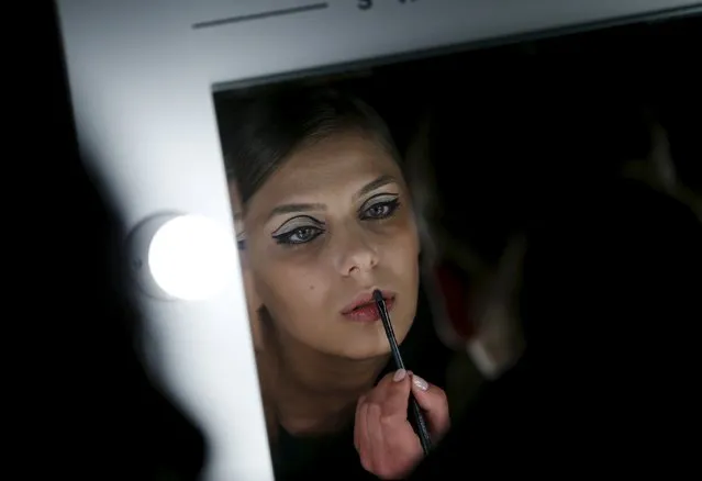 A model gets ready backstage during Tbilisi Fashion Week in Tbilisi, April 16, 2015. (Photo by David Mdzinarishvili/Reuters)