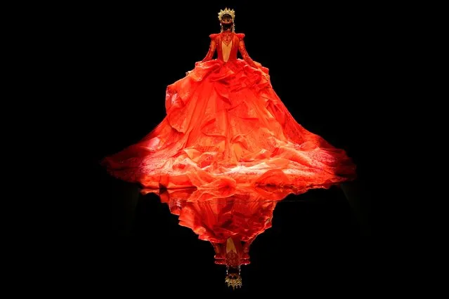 A model presents a gown from the William Zhang collection by designer Hongwei Zhang during the China Fashion Week held in Beijing, China, Wednesday, September 8, 2021. (Photo by Ng Han Guan/AP Photo)