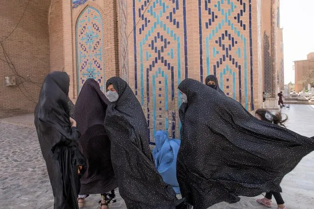 Afghan women walk at a mosque in Herat, Afghanistan on September 10, 2021. (Photo by WANA (West Asia News Agency) via Reuters)