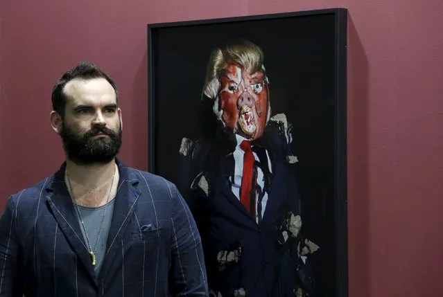 British artist James Ostrer poses beside a photo taken by him of his creation entitled “Emotional Download”, which depicts Republican U.S. presidential candidate Donald Trump, as part of his series “The Ego System”, during an art exhibition in Hong Kong, China March 23, 2016. (Photo by Bobby Yip/Reuters)