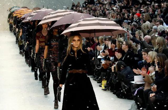 Model Cara Delevingne (C) presents a creation at the Burberry Prorsum 2012 Autumn/Winter collection show during London Fashion Week pn February 20, 2012. (Photo by Suzanne Plunkett/Reuters)