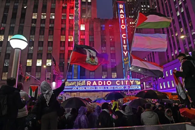 Hundreds of Palestinian supporters protest outside of Radio City Music Hall on March 28, 2024 while inside President Biden is joined by former presidents Obama and Clinton for a fund raising event tonight. The NYPD was also out in full force. (Photo by Andrea Renault/ZUMA Press Wire/Rex Features/Shutterstock)