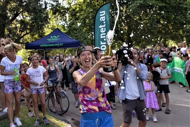 Australian Erchana Murray-Bartlett crosses the finish line at the Pillars of Wisdom at the Tan Track in Melbourne on January 16, 2023. Murray-Bartlett completed 107 consecutive daily marathons, breaking the Guinness World Record. (Photo by Diego Fedele/AAP)