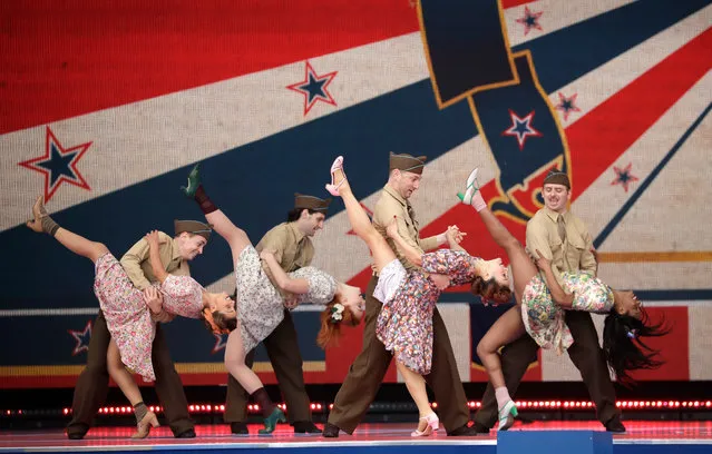 Dancers in period costume perform during an event to mark the 75th anniversary of D-Day in Portsmouth, England Wednesday, June 5, 2019. World leaders including U.S. President Donald Trump are gathering Wednesday on the south coast of England to mark the 75th anniversary of the D-Day landings. (Photo by Matt Dunham/AP Photo)